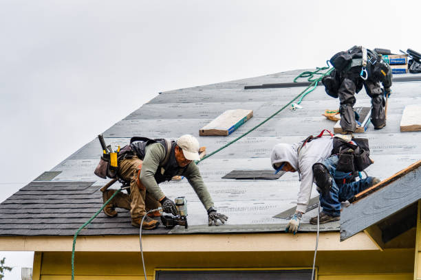 Professional Roofing technician working in Calverton, NY